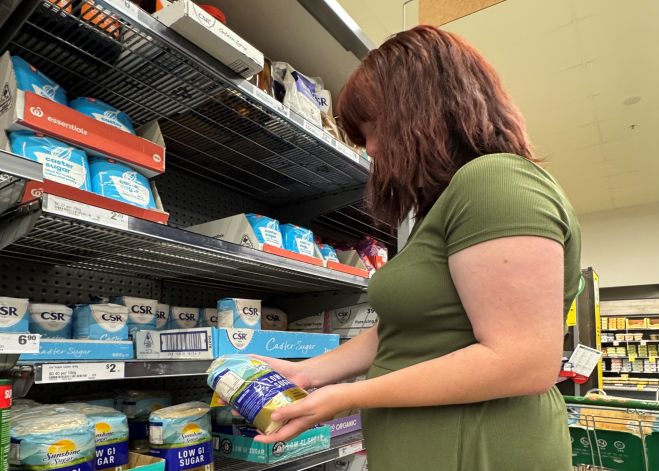 Woman Selecting Sugar Pack
