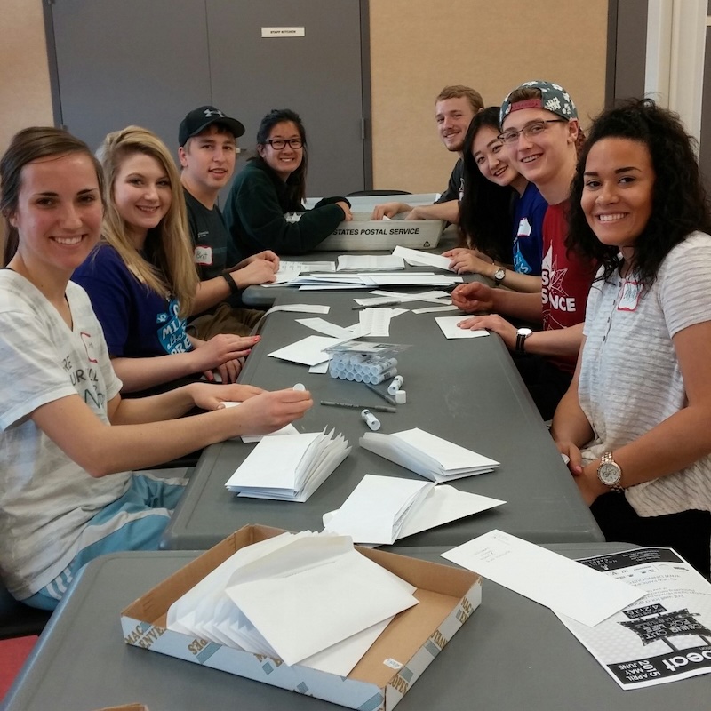 Nashville Cares volunteers prepare a bulk mailing for the organization. 
